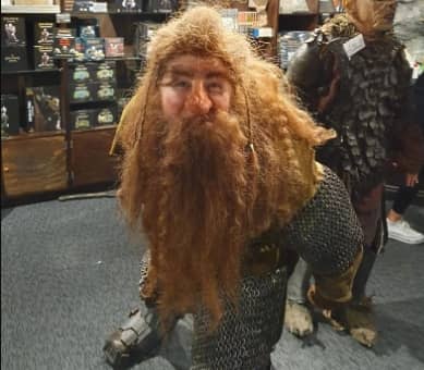 Medieval figure with red beard and chainmail in a museum exhibit.